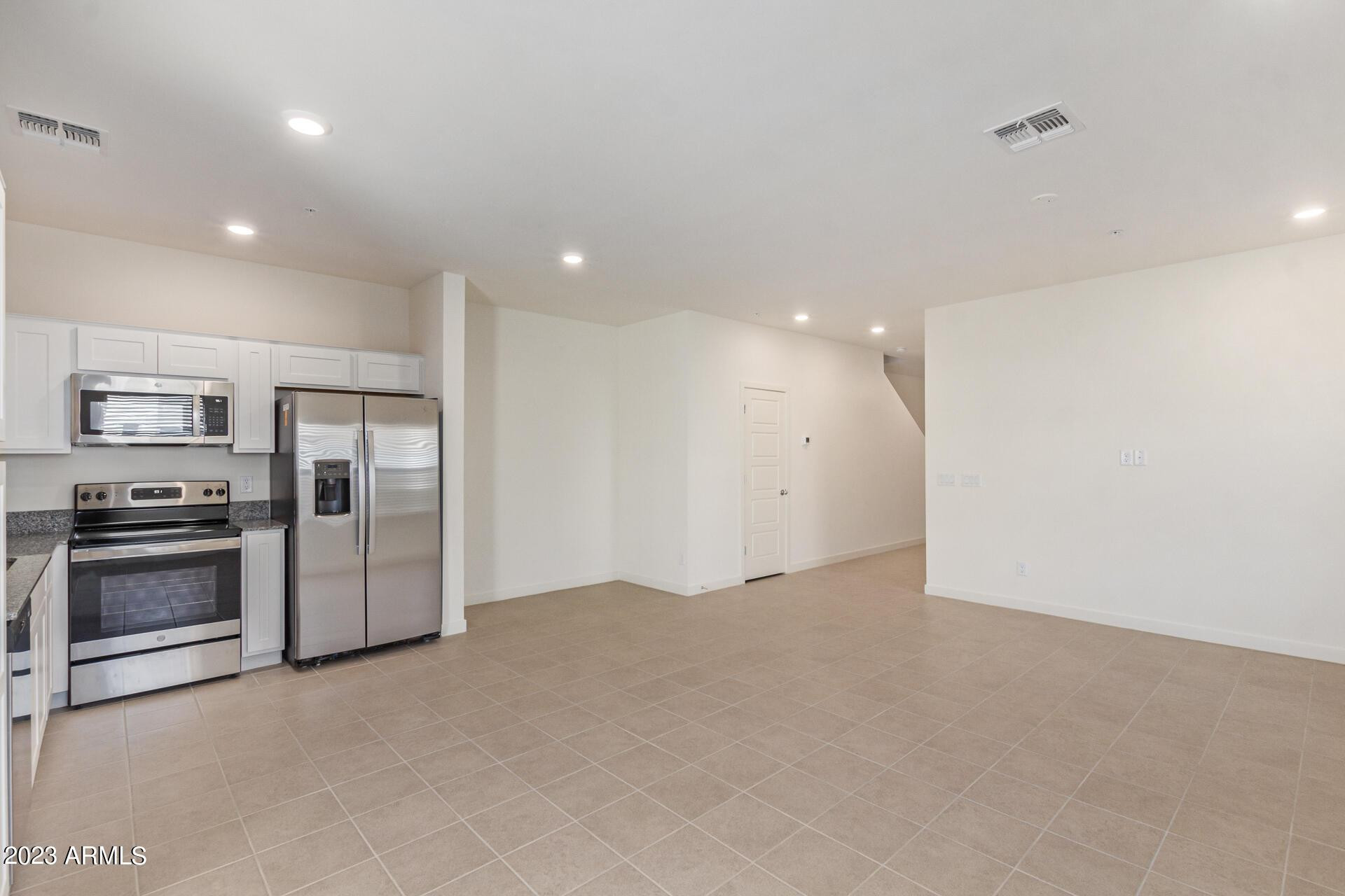 2280 West Laurie Lane Phoenix, AZ 85021 - Photo 5 of 27 a view of a kitchen with a sink stove and a refrigerator