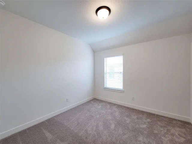 a spacious bathroom with a double vanity sink mirror and toilet