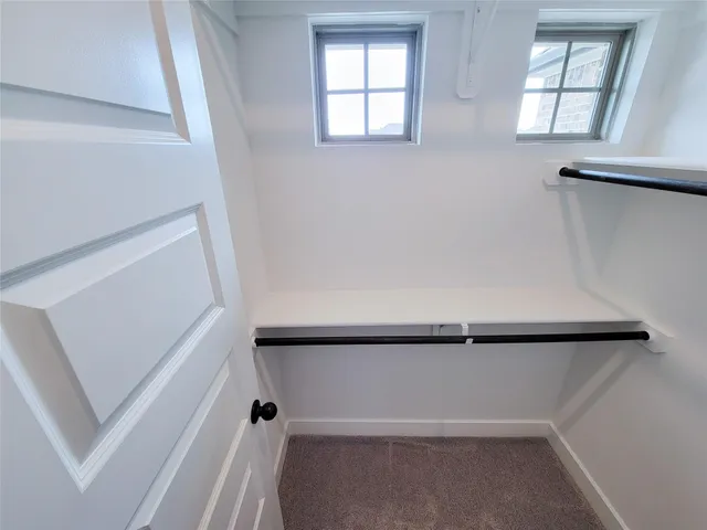 a bathroom with a double vanity sink mirror and bathtub