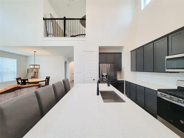 a view of a walk in closet with empty racks