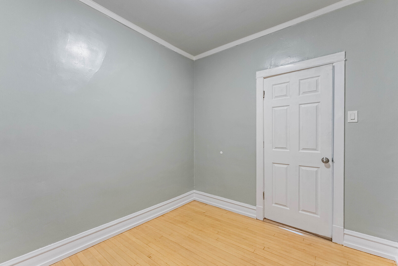 4200 West 21st Place, Unit 2F Chicago, IL 60623 - Photo 18 of 19 wooden floor in an empty room
