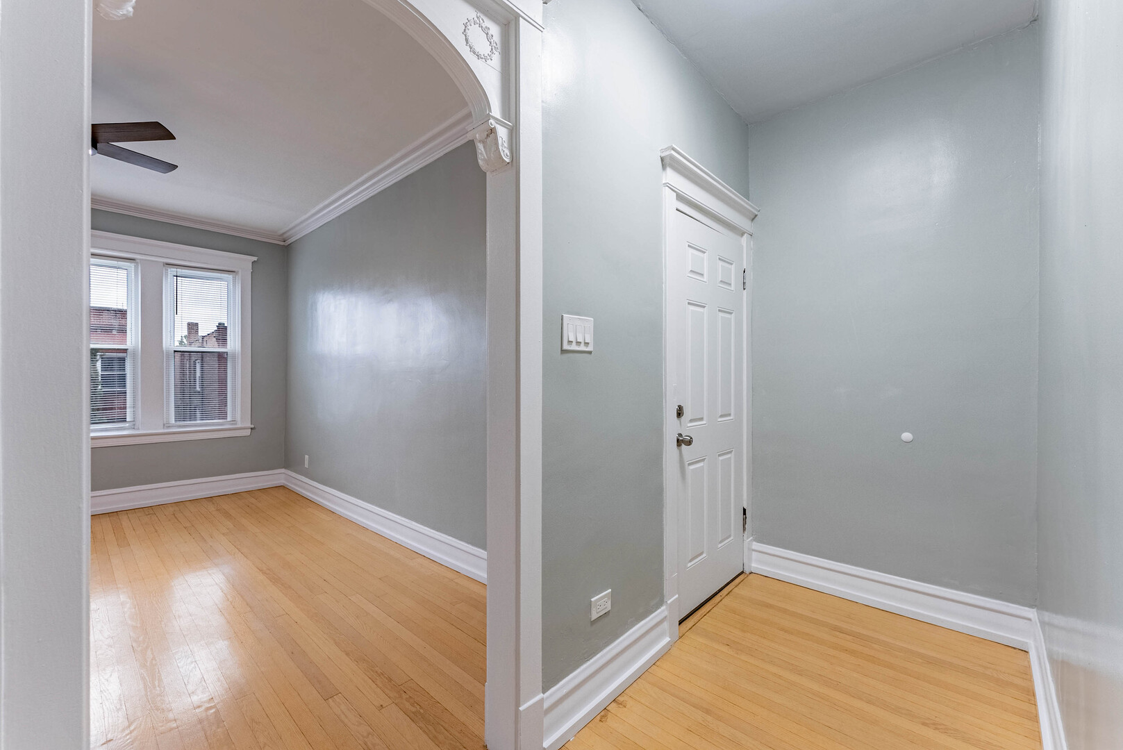 4200 West 21st Place, Unit 2F Chicago, IL 60623 - Photo 7 of 19 wooden floor in an empty room with a window