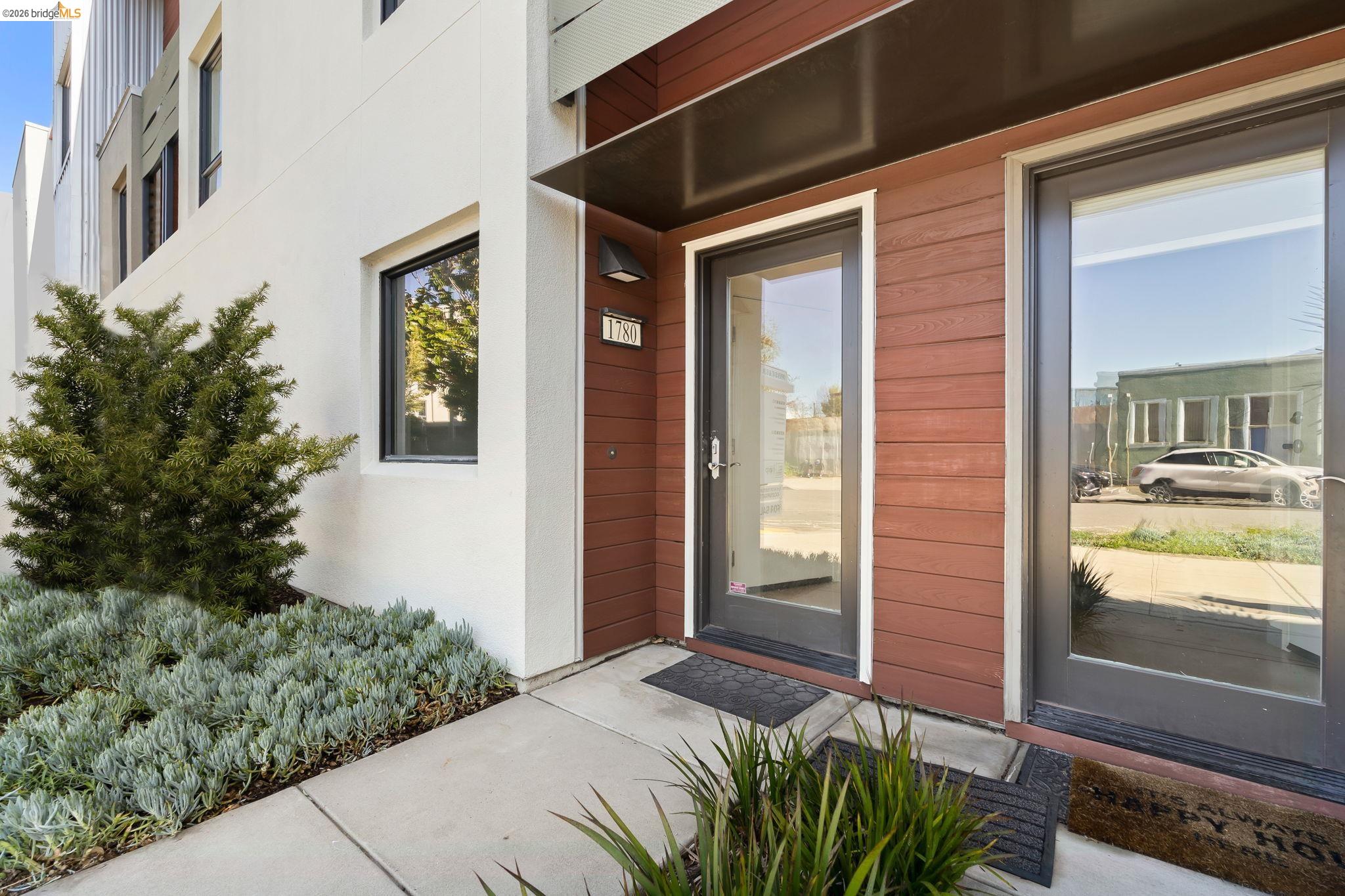 1780 12th Street Oakland, CA 94607 - Photo 3 of 31 a front view of a house with a yard