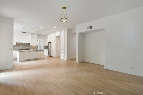 a bathroom with a sink mirror and vanity