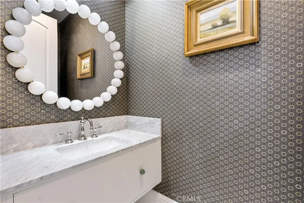 a spacious bathroom with a sink a mirror and a shower