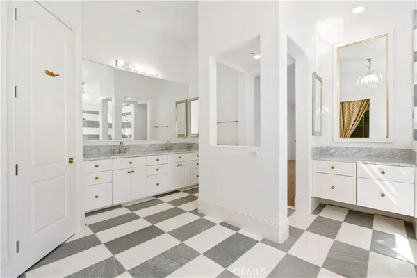 a bathroom with a granite countertop sink a toilet and shower