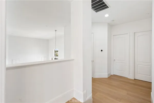 a white house with a large pool table and chairs