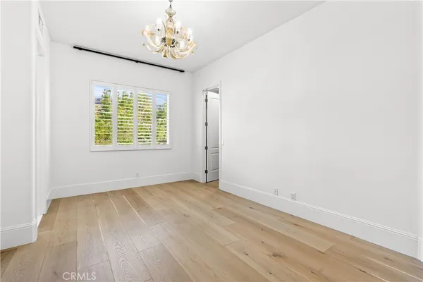 a view of a patio with table and chairs and potted plants