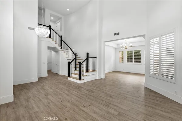 a kitchen with stainless steel appliances granite countertop a sink a stove and a refrigerator