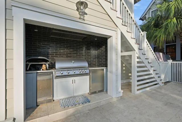 a view of a porch with wooden floor and outdoor seating