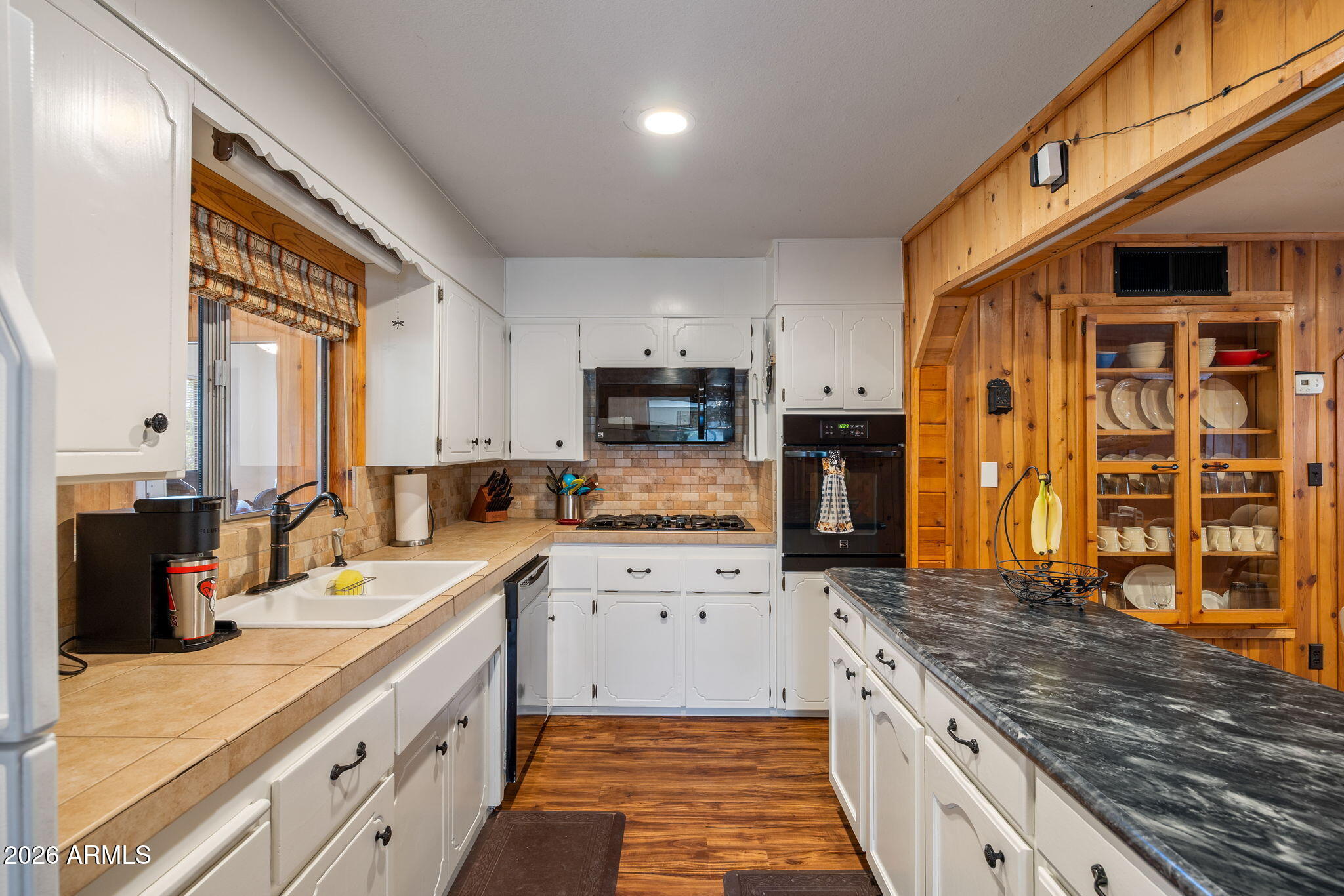 3384 Turkey Run Overgaard, AZ 85933 - Photo 12 of 37 a large kitchen with stainless steel appliances granite countertop a stove refrigerator and cabinets
