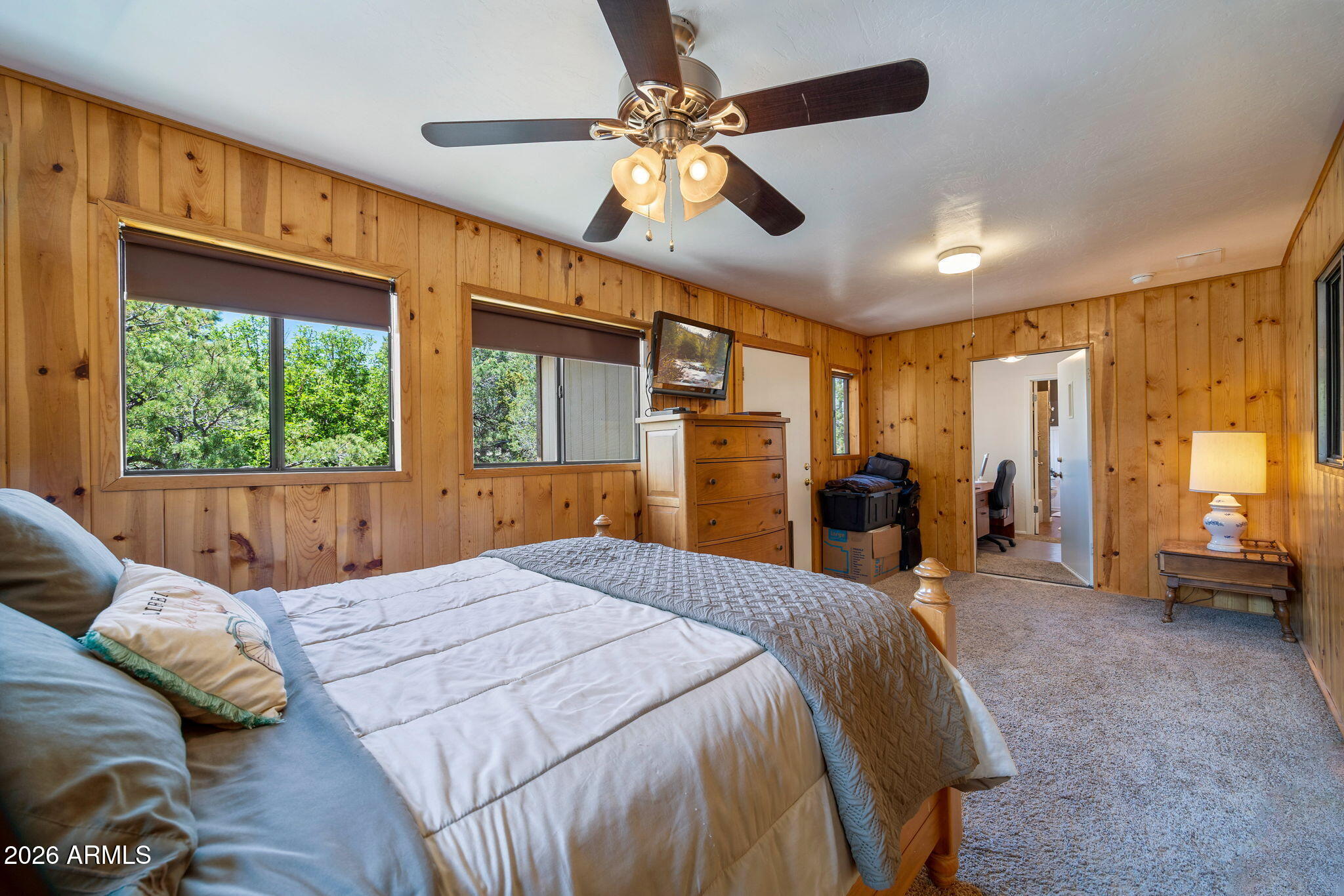 3384 Turkey Run Overgaard, AZ 85933 - Photo 14 of 37 a bed room with a bed and a large window