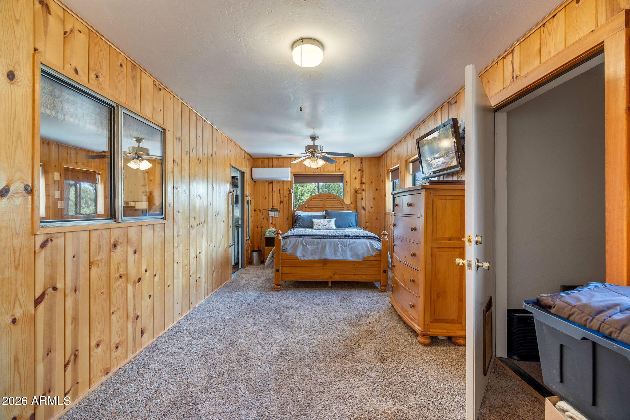 3384 Turkey Run Overgaard, AZ 85933 - Photo 15 of 37 a bedroom with bed and wooden door