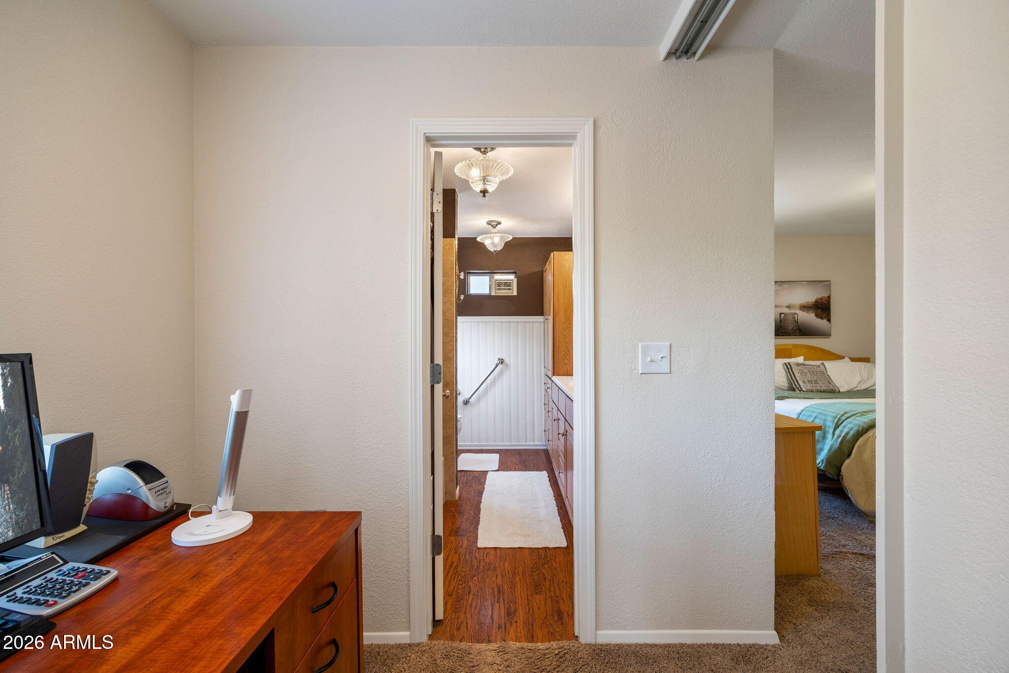 3384 Turkey Run Overgaard, AZ 85933 - Photo 17 of 37 a bedroom with a bed and a wooden floor