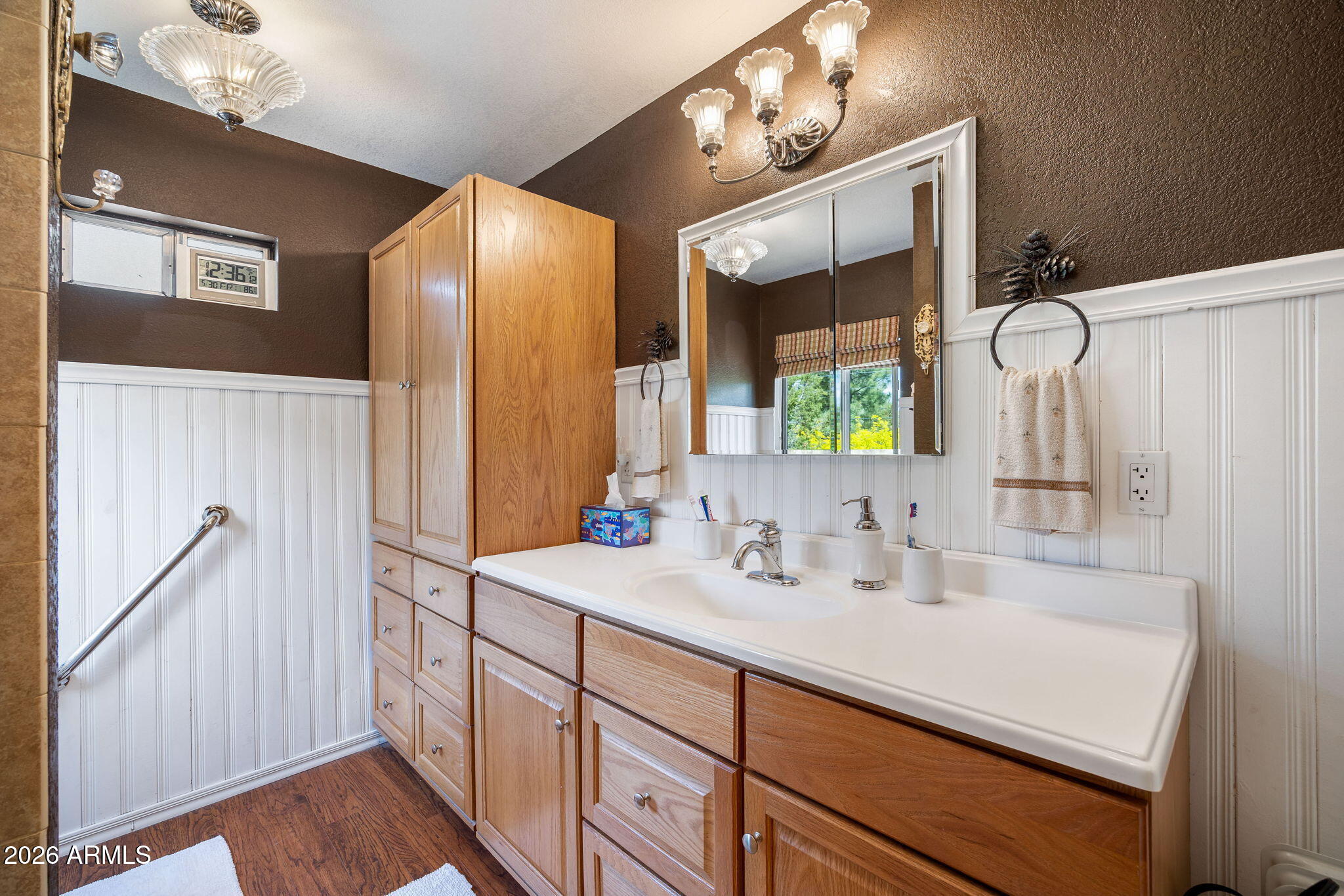 3384 Turkey Run Overgaard, AZ 85933 - Photo 18 of 37 a bathroom with a double vanity sink and a mirror