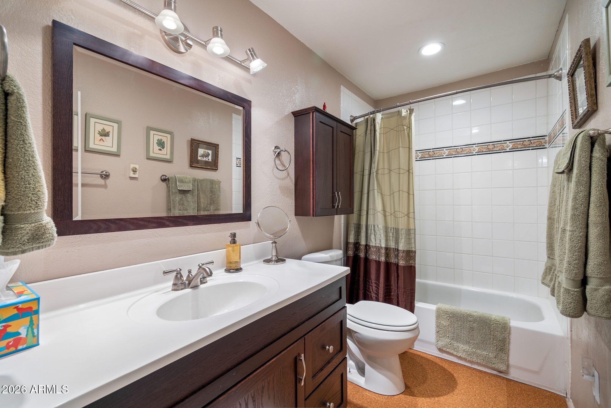3384 Turkey Run Overgaard, AZ 85933 - Photo 23 of 37 a bathroom with a double vanity sink toilet mirror and shower