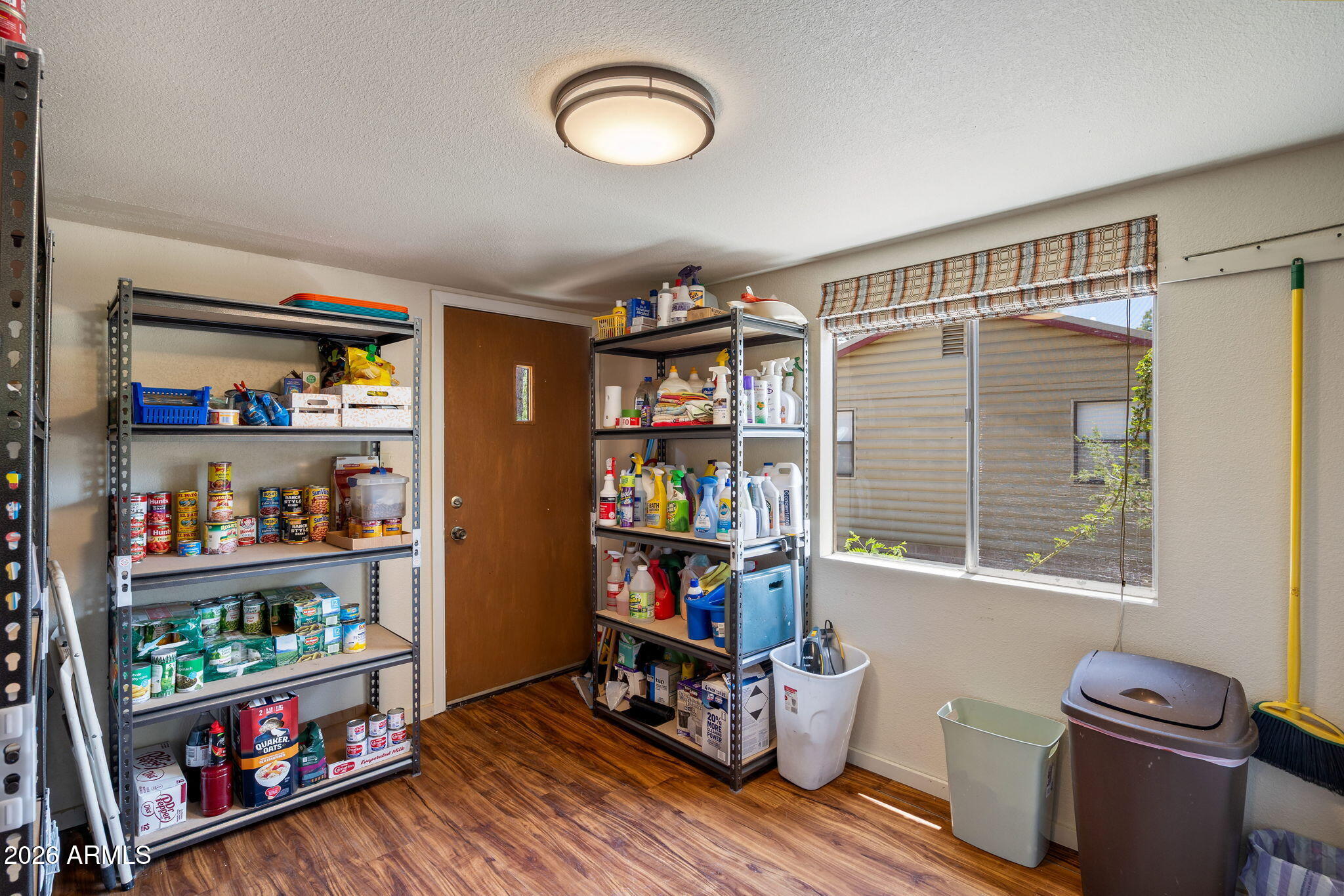 3384 Turkey Run Overgaard, AZ 85933 - Photo 25 of 37 a room with wooden furniture and a book shelf