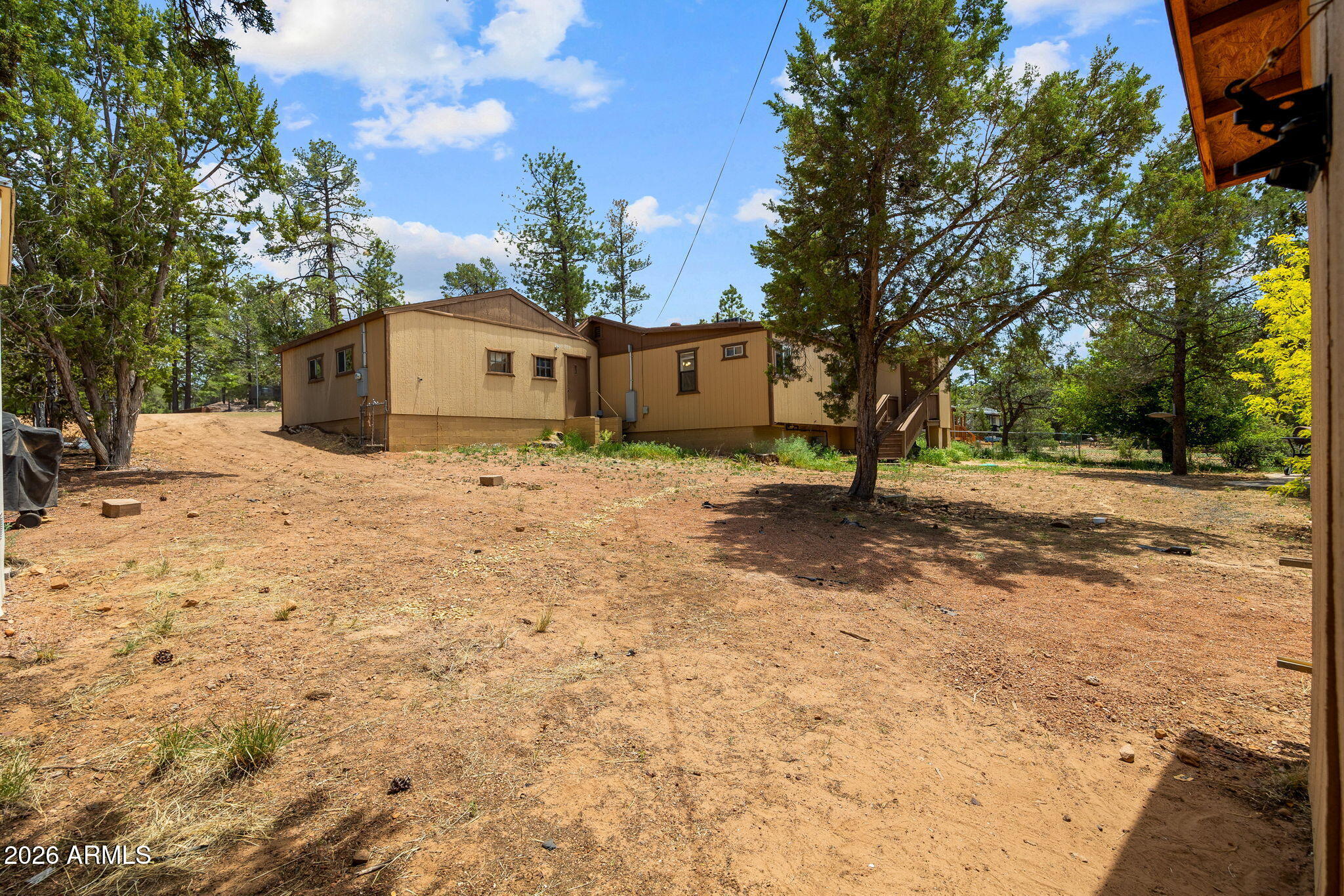 3384 Turkey Run Overgaard, AZ 85933 - Photo 28 of 37 a view of a house with a yard
