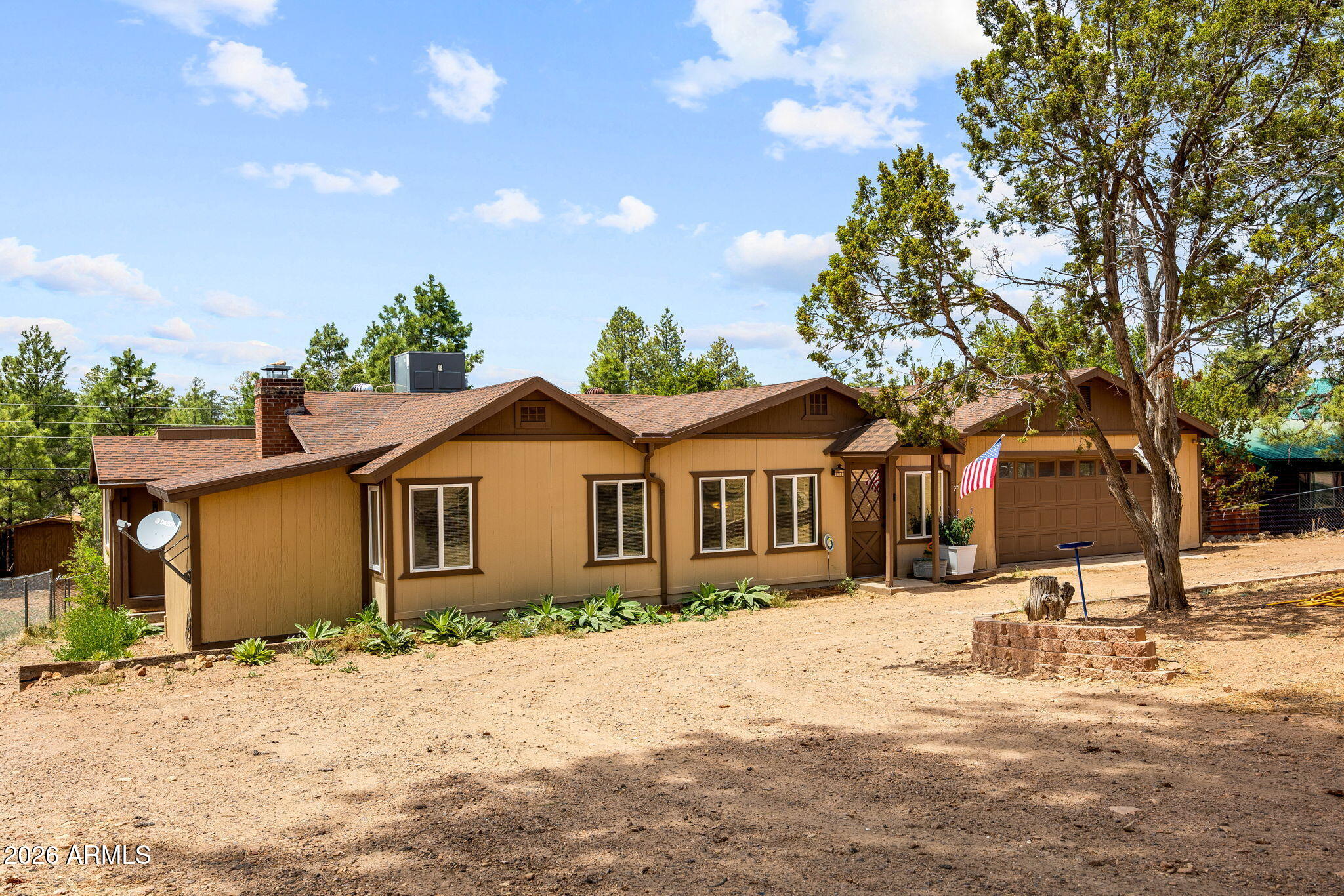 3384 Turkey Run Overgaard, AZ 85933 - Photo 37 of 37 a front view of a house with a yard covered in snow