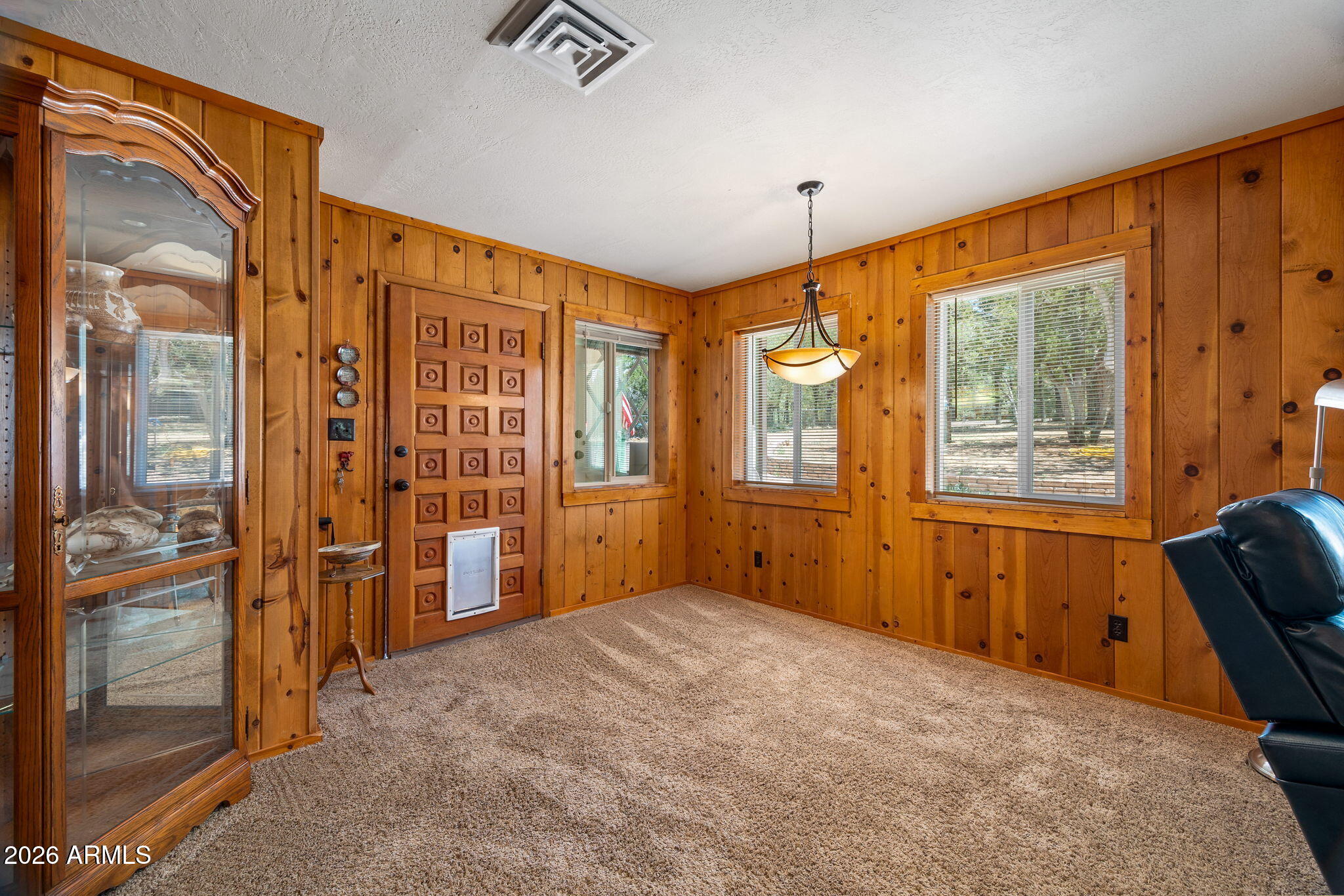 3384 Turkey Run Overgaard, AZ 85933 - Photo 6 of 37 a bedroom with furniture and large window