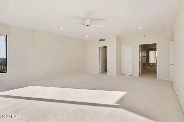 a kitchen with kitchen island granite countertop a sink counter top space appliances and cabinets