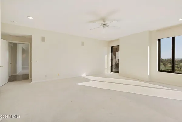 a large kitchen with kitchen island a sink stainless steel appliances and cabinets
