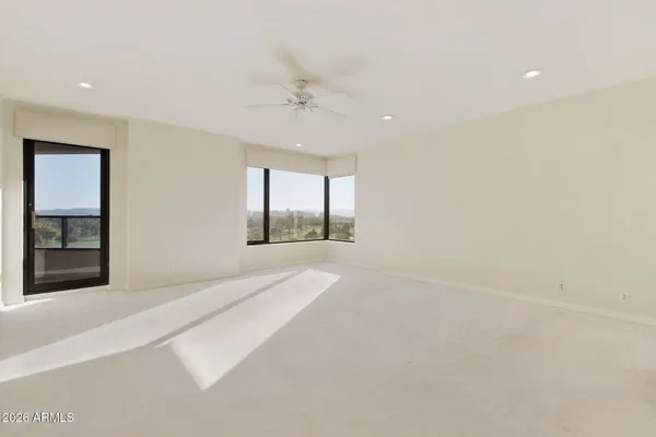 a kitchen with stainless steel appliances granite countertop a sink and a refrigerator