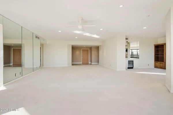a view of an empty room with a window