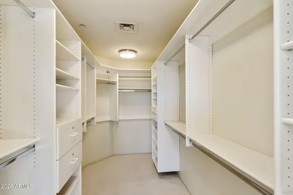a spacious bathroom with a tub shower sink and mirror