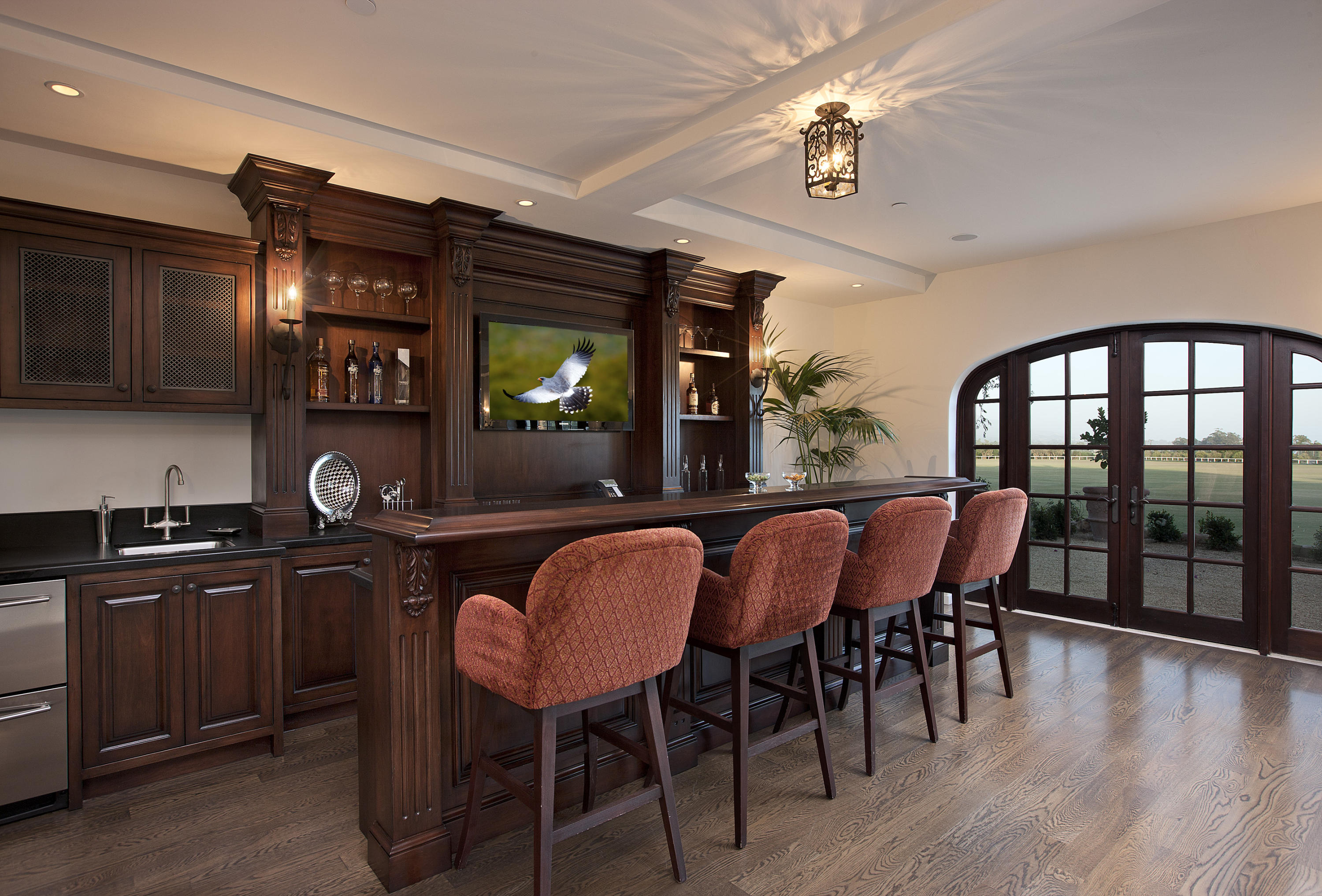 3215 Foothill Road Carpinteria, CA 93013 - Photo 11 of 20 a dining room with furniture a chandelier and wooden floor