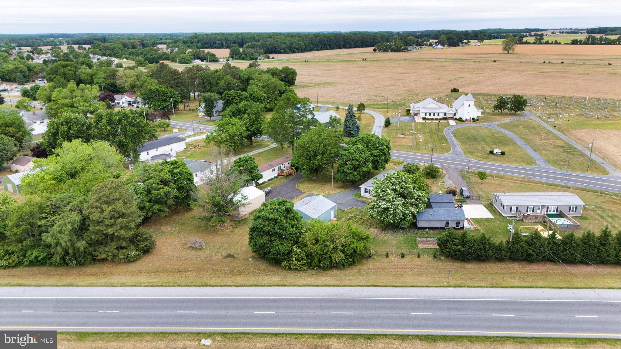 23212 Argos Corner Road Milford, DE 19963 - Photo 29 of 36 a view of a lake with big yard and large trees
