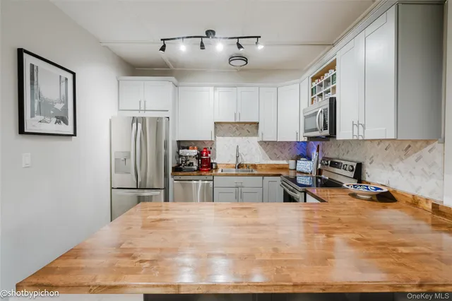 a kitchen with refrigerator and window