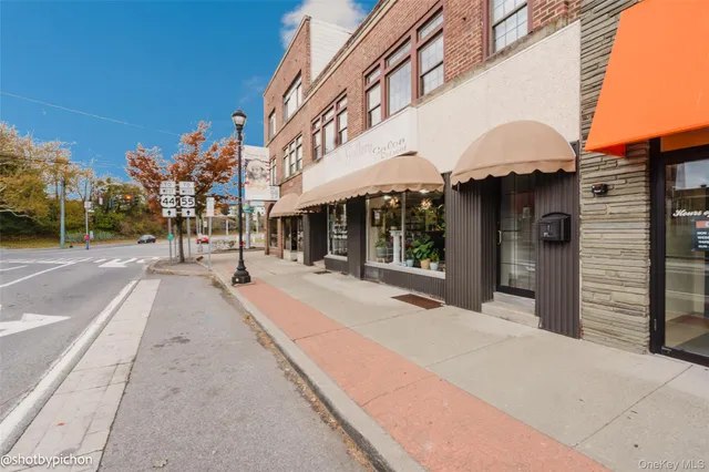 a front view of a building with retail shops