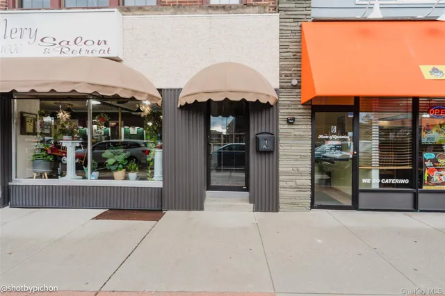 a view of a house with a door and a balcony