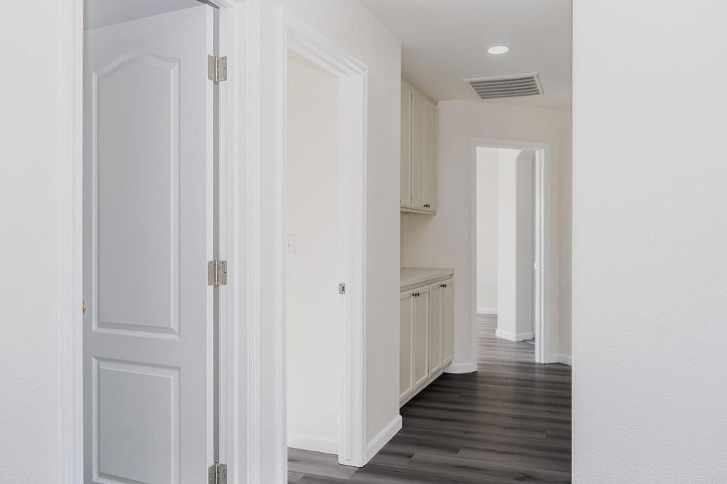 3005 Litt Road Modesto, CA 95355 - Photo 31 of 53 a view of a hallway with wooden floor