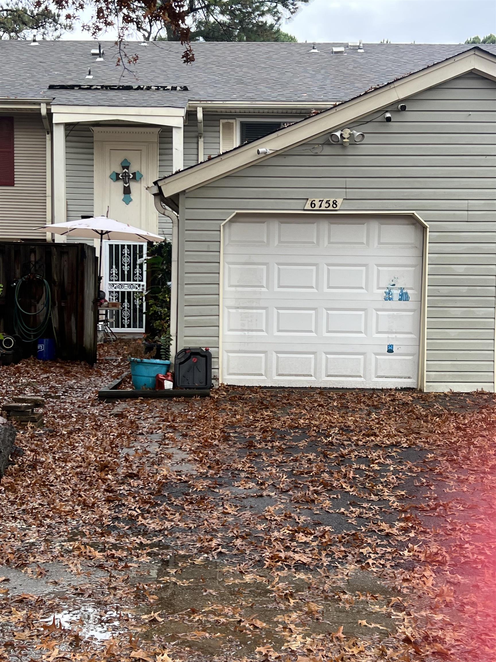6758 Racquet Club Drive, Unit 6758 Memphis, TN 38119 - Photo 6 of 7 a front view of a house with a yard