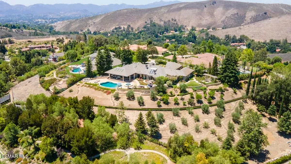 an aerial view of residential house with an outdoor space