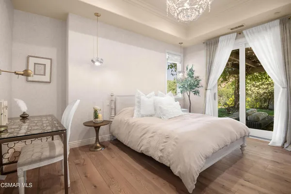 a bedroom with a bed and lamp