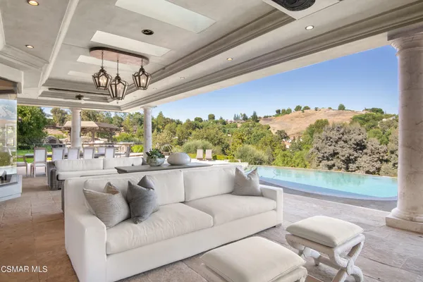 a balcony with furniture and outdoor view
