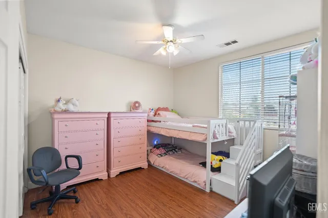 a bedroom with a workspace