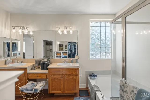 a dining room with a sink and a mirror