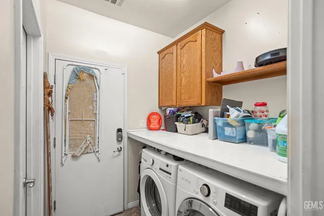 a bathroom with a sink a washer and dryer