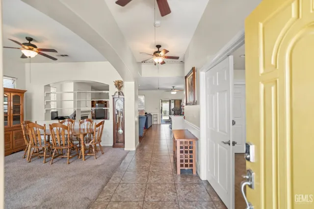a view of a very nice looking dining room with furniture chandelier and a fireplace