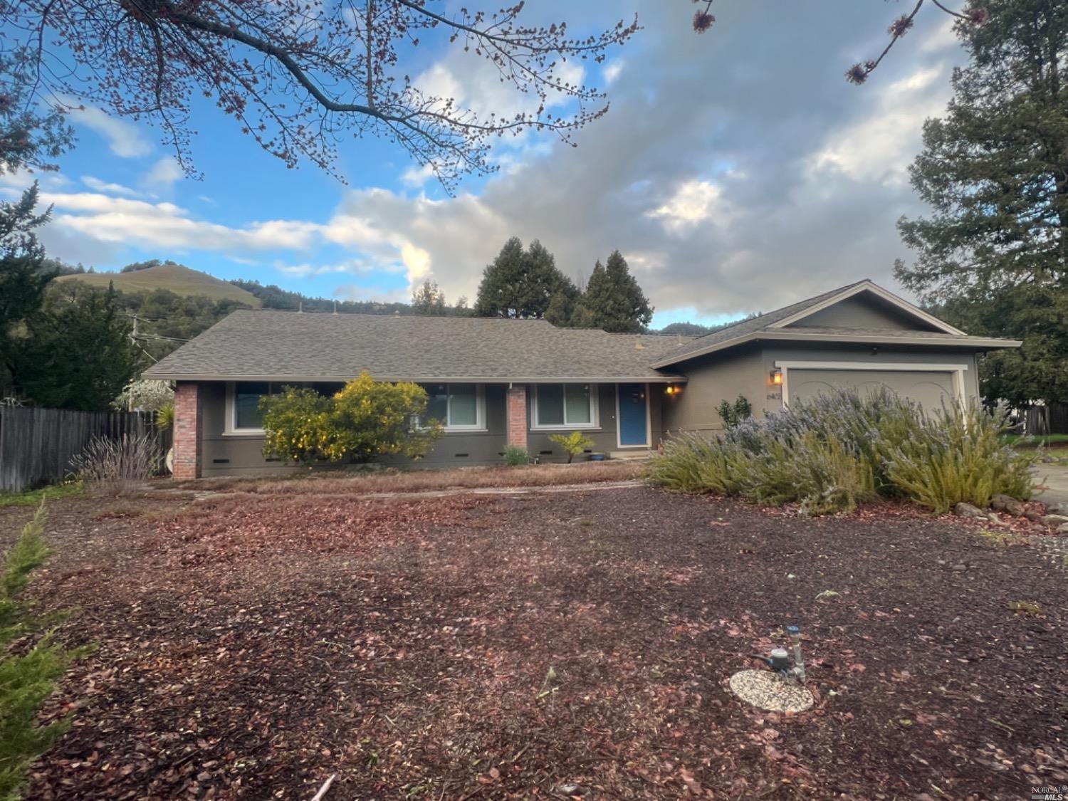 6405 Bennett Valley Road Santa Rosa, CA 95404 - Photo 1 of 1 a front view of a house with a garden