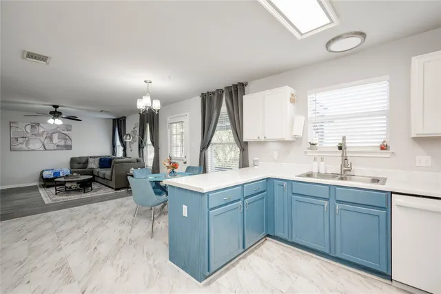 a view of a house with backyard and porch