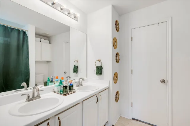 a view of walk in closet with clothes