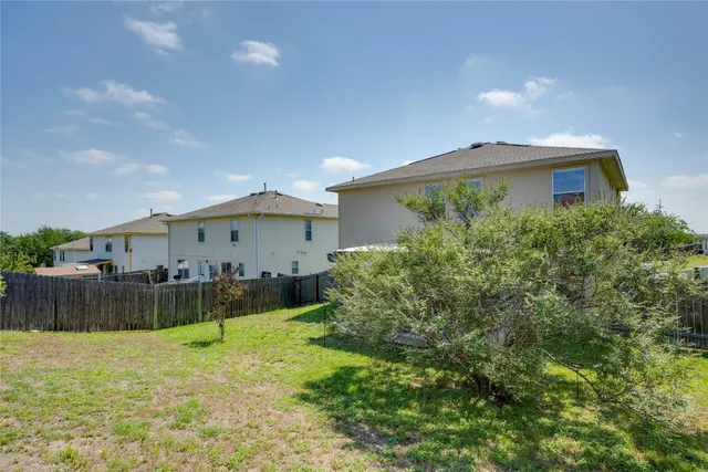 a building outdoor space with patio furniture and wooden floor