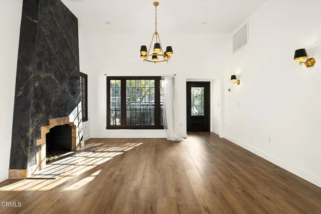 a view of an entryway with wooden floor