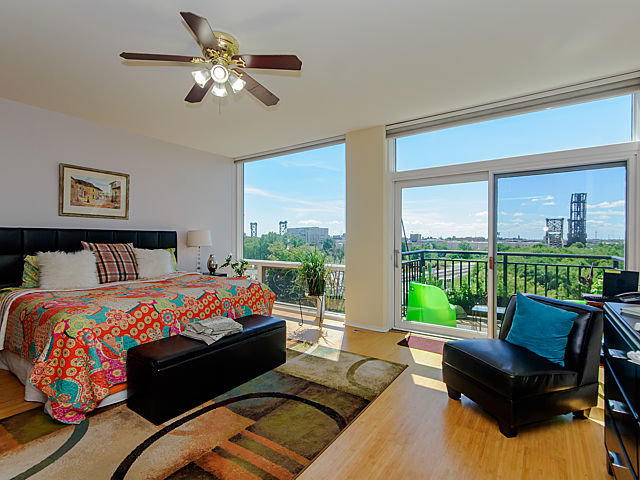 61 West 15th Street, Unit 607 Chicago, IL 60605 - Photo 11 of 23 a bedroom with a bed couch and a large window