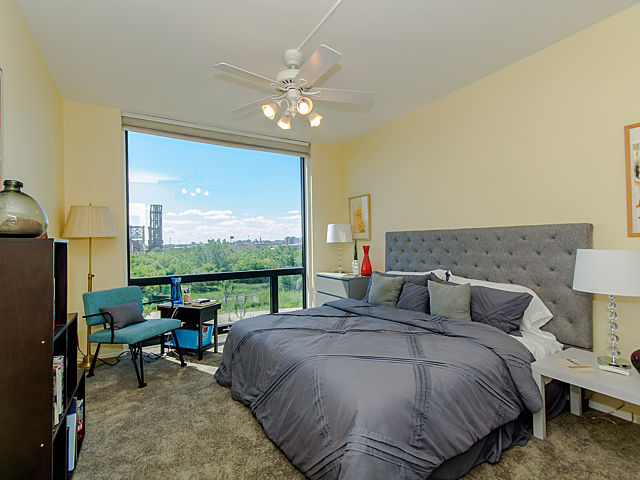 61 West 15th Street, Unit 607 Chicago, IL 60605 - Photo 13 of 23 a bedroom with a bed and large windows
